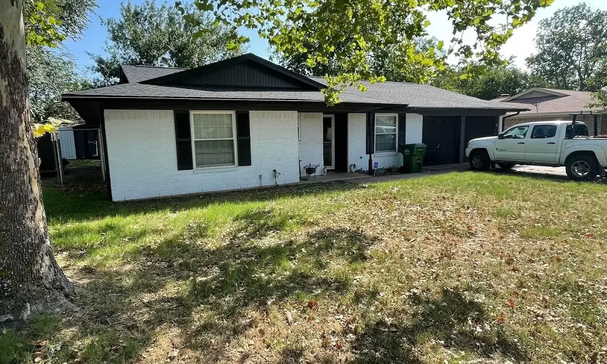 Professional roofing crew working on a residential roof in Martha Lake